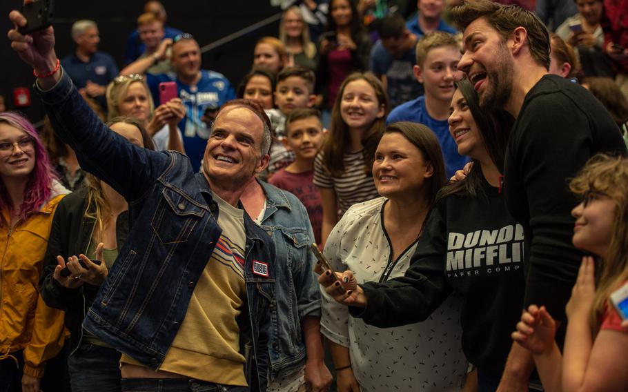John Krasinski and Michael Kelly, from the Amazon series ''Jack Ryan,'' visit with servicemembers and their families before a premiere of season two at the Ramstein Air Base theater, Germany, Oct. 15, 2019.