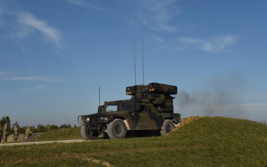 Soldiers fire a .50-caliber machine gun from an Avenger short-range air defense missile system at ground targets at the Grafenwoehr Training Area, Tuesday, Oct. 16, 2019.