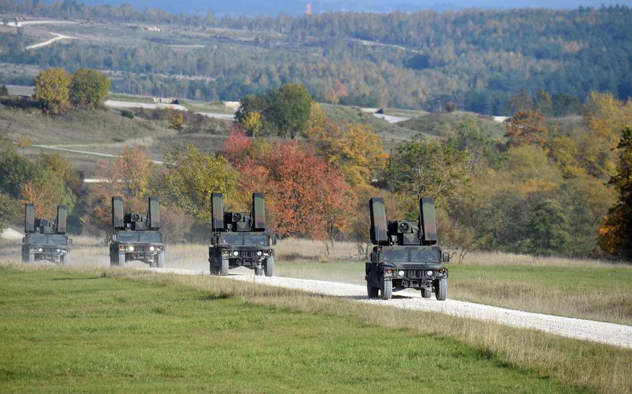 Avenger short-range air defense missile systems mounted on Humvees drive toward their targets at the Grafenwoehr Training Area, Tuesday, Oct. 16, 2019.