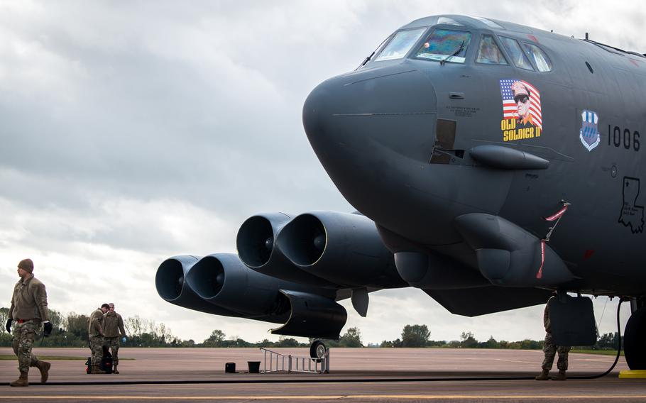 Airmen work on a B-52 Stratofortress at RAF Fairford, England, October 18, 2019. One of the planes deployed to England from Barksdale Air Force Base, La., lost a part during flight that landed in a garden in Brailes, England.