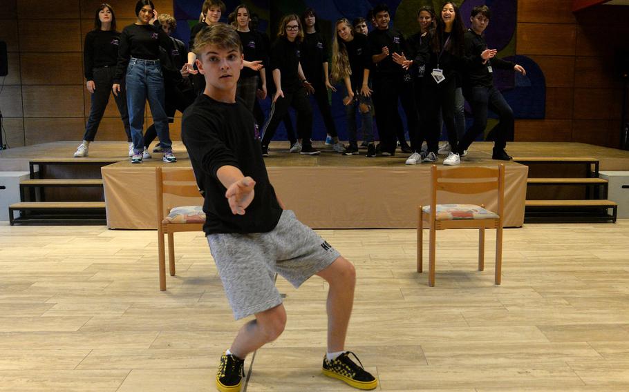Stuttgart's Caden Burkman shows the Creative Connections show choir his choreography for a number they are working on for Thursday's show.