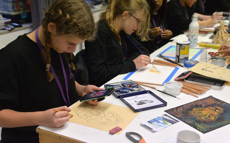 In the 2D design and drawing workshop at this year's Creative Connections in Oberwesel, Germany, Josie Christiansen from Vicenza and Stuttgart's Elena Bryson work on their art works.