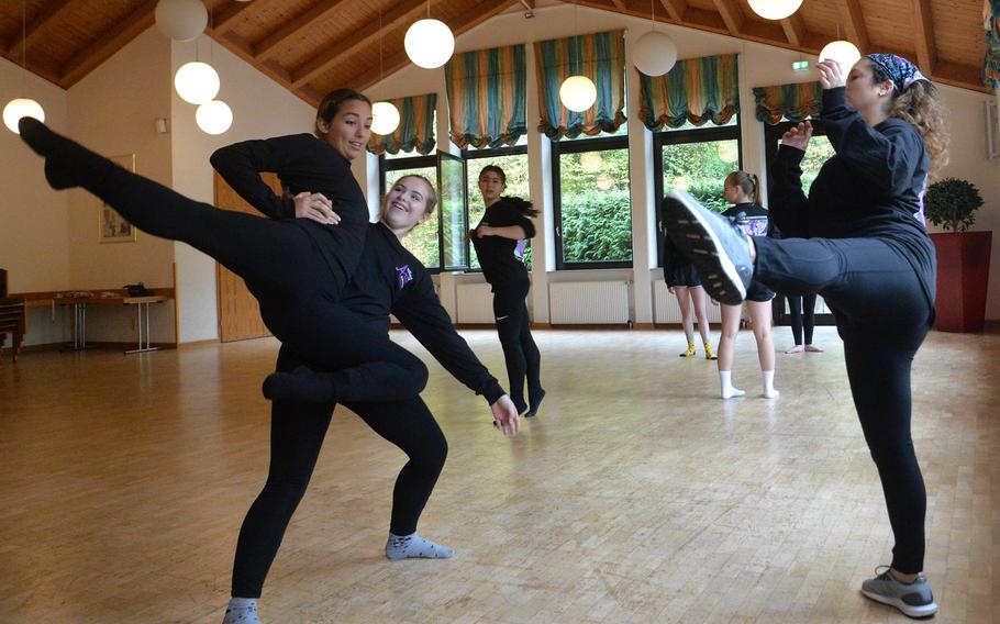 Maya Cabrera from Naples supports Vilseck's Alexana Voudouris as they go through a dance move with instructor Ruth Wareham from Alconbury, during the dance workshop at Creative Connections in Oberwesel, Germany, Monday, Nov. 4, 2019.