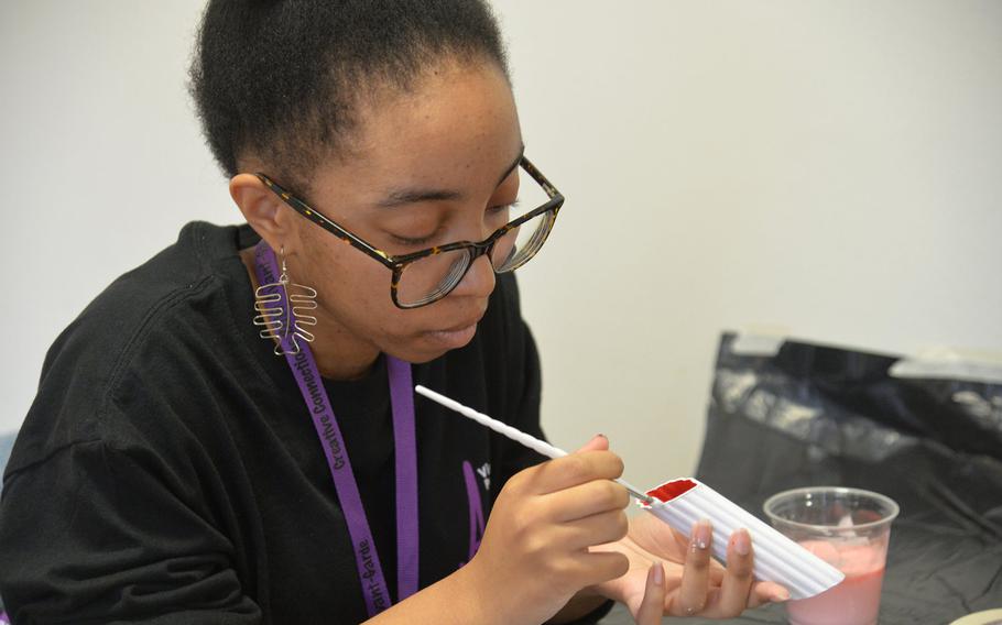 In the mixed media workshop at Creative Connections, Alconbury's Terrica Davis paints a manicotti noodle for the project she was working on, Monday, Nov. 4, 2019.