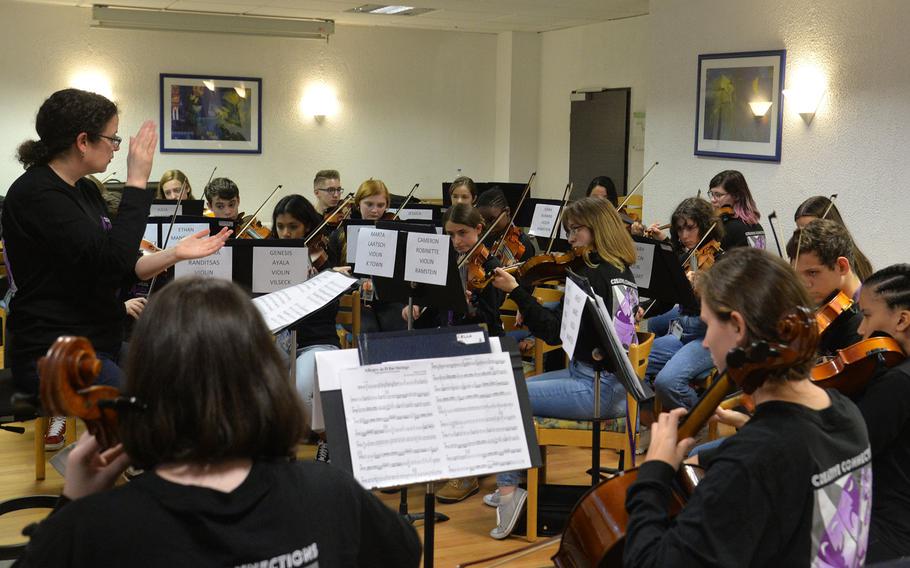 Rebecca Dosch of Supreme Headquarters Allied Powers Europe Middle School in Belgium, claps out the rhythm as the string ensemble rehearse a number at Creative Connections in Oberwesel, Germany, Monday, Nov. 4, 2019.