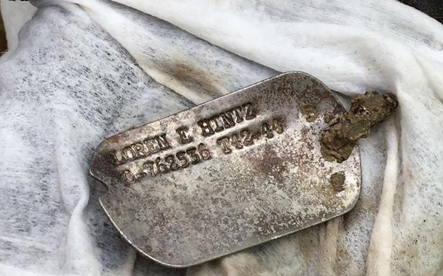 This dog tag belonging to 1st Lt. Loren Hintz was recovered in an excavation three years ago in Italy, where Hintz's P-47 Thunderbolt crashed in April 1945. His descendants are attending a burial ceremony for his remains Saturday at the American cemetery in Florence, Italy.