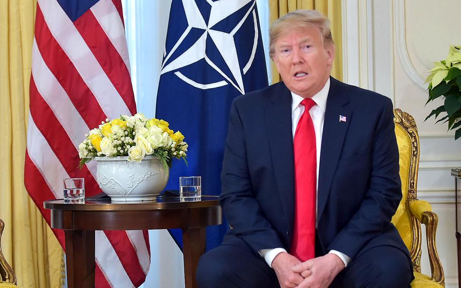 U.S. President Donald Trump anwers a question from the media after he and NATO Secretary-General Jens Stoltenberg delivered opening remarks at Winfield House in London, ahead of the NATO summit in London, Tuesday, Dec. 3, 2019.