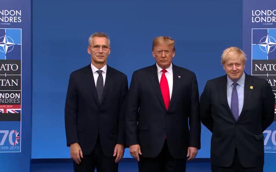 NATO Secretary-General  Jens Stoltenberg, U.S. President Donald Trump and British Prime Minister Boris Johnson at the handshake ceremony before the meeting of NATO leaders on the outskirts of London, Wednesday, Dec. 4, 2019.