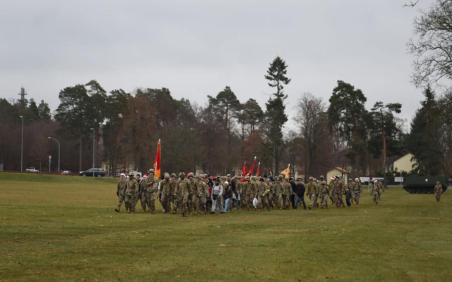 German and American soldiers marched 3 miles at Grafenwoehr Training Area with service members and their children as part of a toy drop, which will deliver hundreds of toys and school supplies to the Haus St. Elisabeth children's home in Windischeschenbach, Germany.