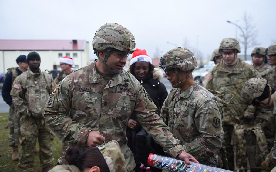 Sgt. Maj. Joshua Kazaka, with 1st Battalion, 6th Field Artillery Battalion, 41st Field Artillery Brigade, helps collect donated toys at Grafenwoehr, Germany, on Dec. 12, 2019. Some 600 toys and school supplies were collected and will be distributed to German and American children in need.
