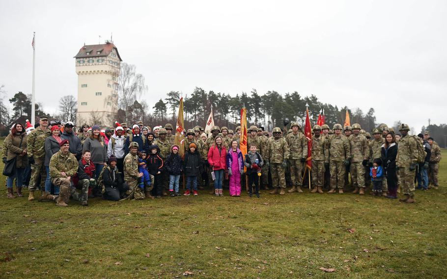 Soldiers pose for a photo at Grafenwoehr, Germany, on Dec. 12, 2019, where a toy drop was organized to collect and distribute some 600 toys and school supplies to children in need.