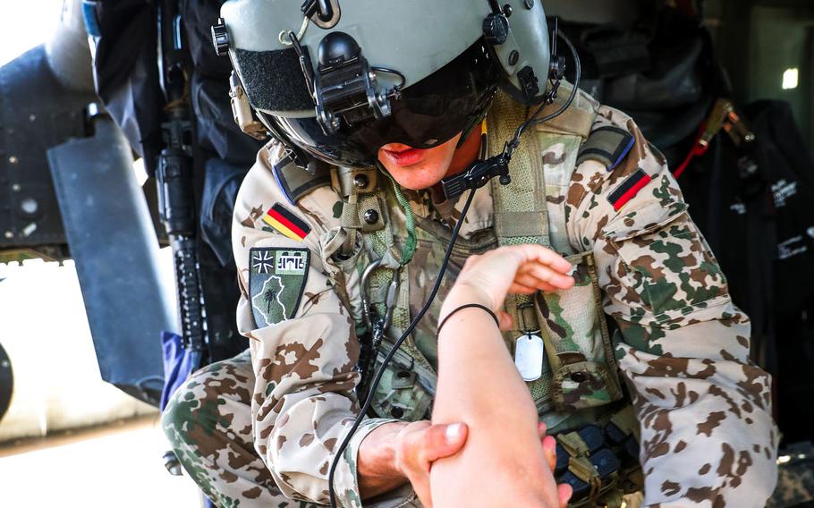 A German soldier examines another soldier during aeromedical training in Iraq in May 2019. Some allies have begun pulling their forces out of Iraq because of security concerns in the country. Germany will send 30 of its 120 soldiers in Iraq to Jordan and Kuwait.