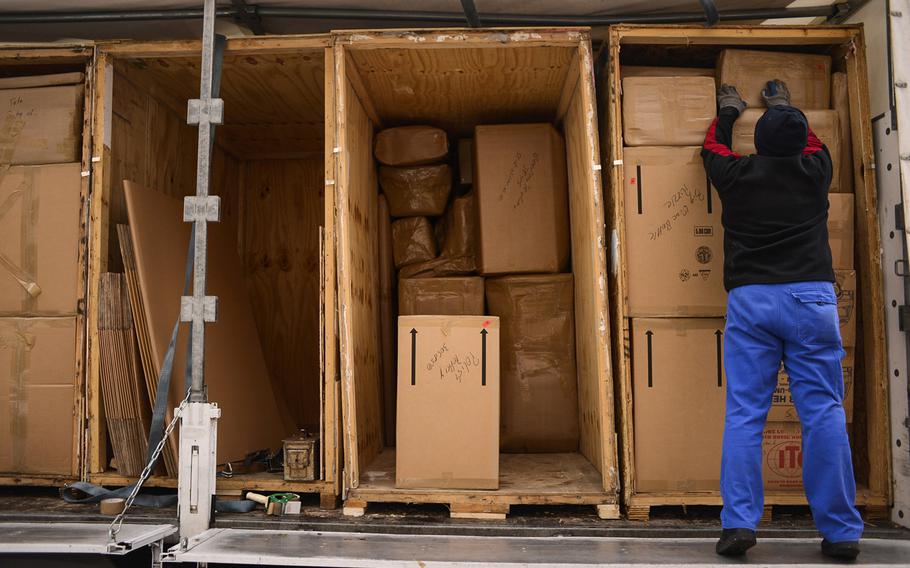 A mover packs household goods onto a truck in Kaiserslautern, Germany in this undated file photo.