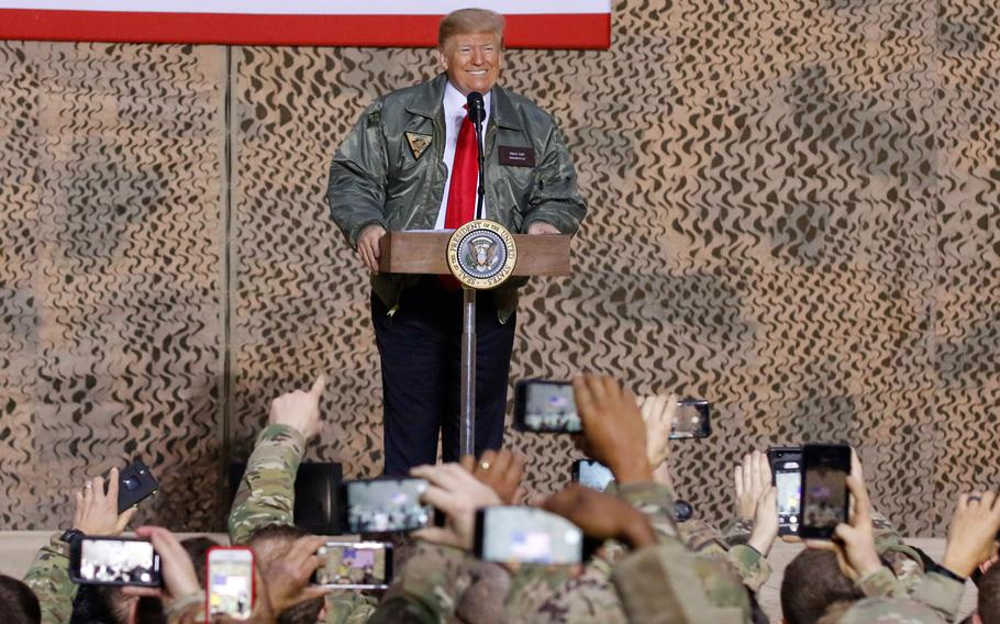 President Donald Trump speaks to service members during a visit to Al Asad Air Base, Iraq, Dec. 26, 2018. Trump proposed expanding NATO to include the Middle East and suggested calling it NATO-ME.