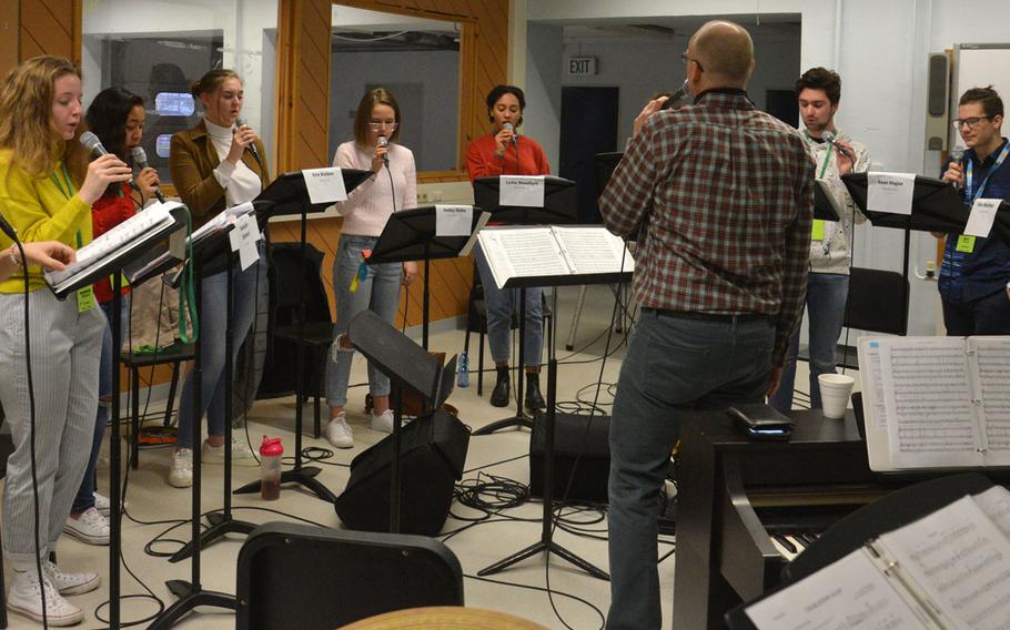 Darmon Meader, the guest clinician and conductor at the 2020 DODEA-Europe Jazz Festival, leads the vocal jazz ensemble through a rehearsal in Kaiserslautern, Germany, Jan. 14, 2020.