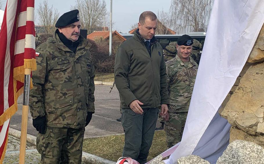 From left, Gen. Jaroslaw Mika, General Commander of the Polish Armed Forces, Polish ambassador to NATO Tomasz Szatkowski and Lt. Gen. Christopher Cavoli, commander of U.S. Army Europe, prepare to unveil a monument at Hohenfels, Germany, on January 27, 2020.