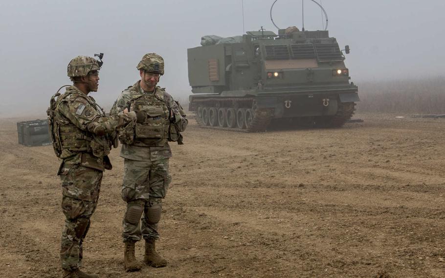 Col. Seth Knazovich, 41st Field Artillery Brigade commander, listens to Lt. Col. Angel Llompart, commander of the 1st Battalion, 6th Field Artillery Regiment, during a reload drill for a live-fire exercise Jan. 27, 2020, in Grafenwoehr, Germany.