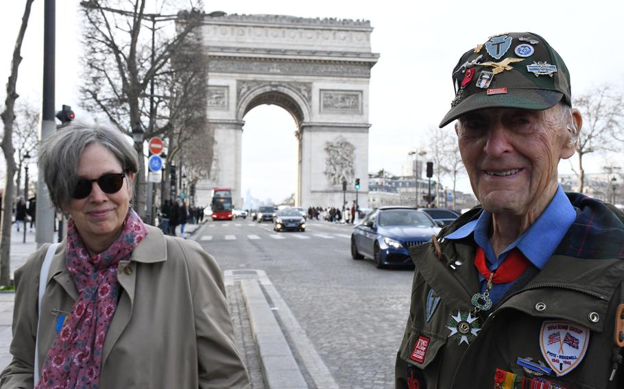 American expatriate Meredith Wheeler and 94-year-old World War II veteran Stephen Weiss are pictured here near Paris's Arc de Triomphe ahead of a ceremony for the rekindling of the eternal flame at the Tomb of the Unknown Soldier under the famous French monument on Friday, Feb. 14, 2020.