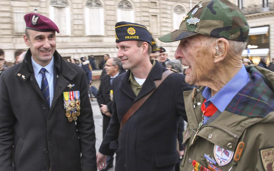 Pictured here, left to right, shortly before a twilight ceremony at the Arc de Triomphe in Paris on Friday, Feb. 14, 2020, are French Afghanistan veteran Cyril Pefaure, U.S. Navy veteran and American Legion post commander Bryan Schell, and World War II Army veteran Stephen Weiss. Weiss worked with the Office of Strategic Services, a precursor of the CIA, behind enemy lines in 1944.