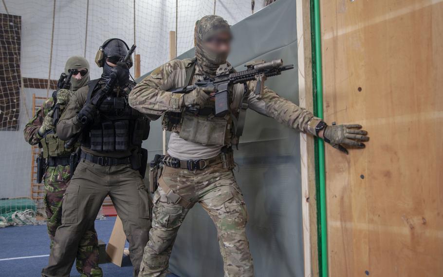 A Navy SEAL prepares to clear a room during counterterrorism drills Feb. 28, 2020, in Belgrade, Serbia, where U.S. Special Operations Command Europe conducted exercises with local forces.The SEAL's face is blurred for security reasons.