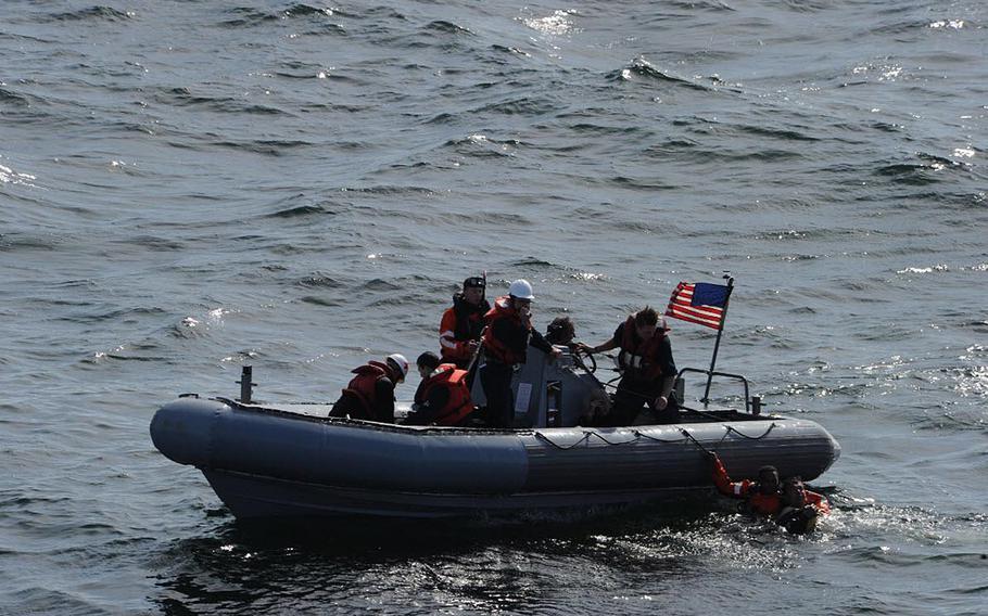 A boat from the destroyer USS Ross conducts search and rescue operations in response to a disaster on a civilian Turkish boat in the Sea of Marmara, offshore of Turkey.