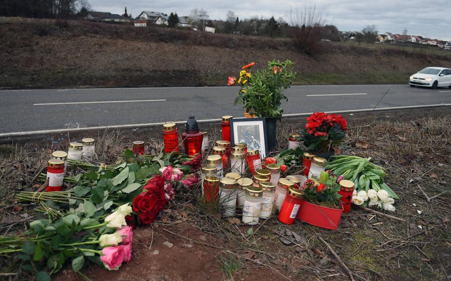 A roadside memorial of flowers and candles was created for a German teenager killed in a car crash near Weilerbach, Germany, in February 2019, involving a young airman assigned to Ramstein Air Base. The Air Force is planning to try the airman for his role in the death.