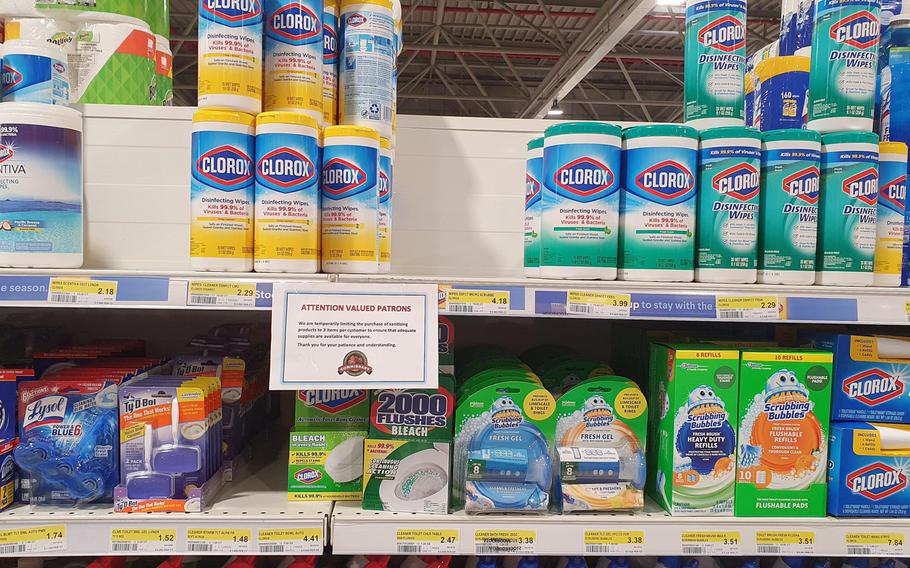 Signs limiting the sale of disinfectant wipes and bottles of hand sanitizer to three per customer are posted at the commissary at Aviano Air Base, Italy, on March 5, 2020. 