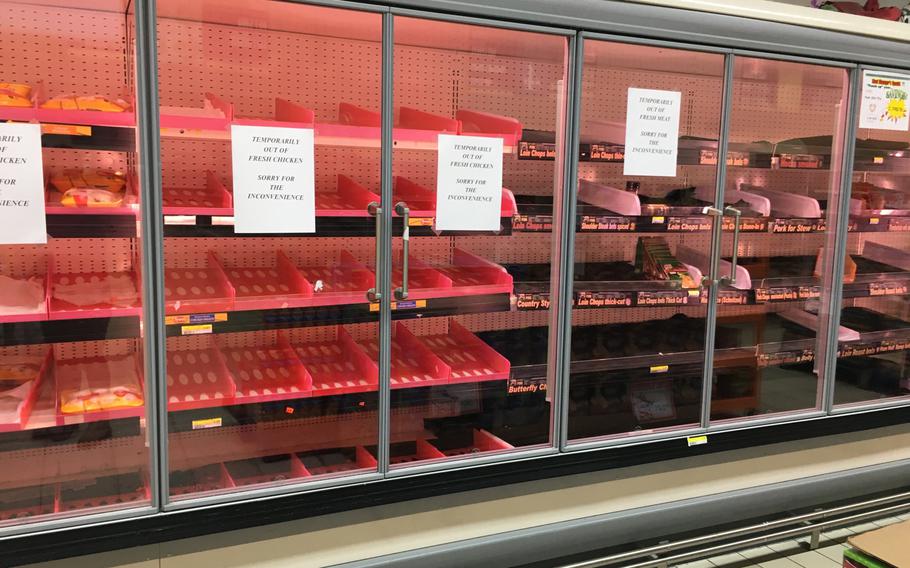 Shelves at the Vogelweh commissary in Germany, sit empty of fresh chicken on Sunday, March 18, 2020. The Defense Commissary Agency has since announced ID checks at entrance and revoked policies allowing visitors to join authorized customers.