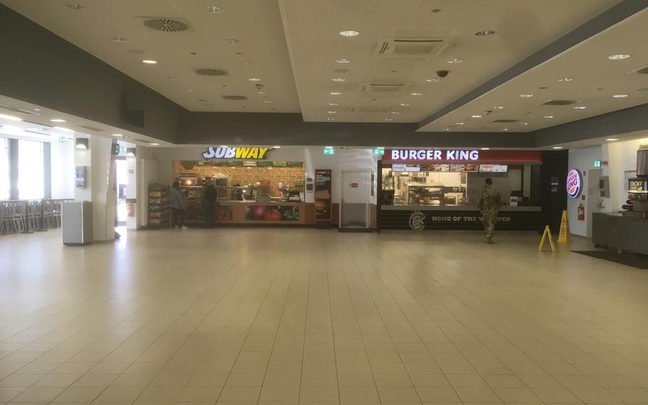 The food court at U.S. European Command's Patch Barracks headquarters in Stuttgart is deserted on Wednesday, March 18, 2020, as the military steps up measures to fight the coronavirus. Tables and chairs have been removed and only take-out orders are available to prevent crowds from gathering.