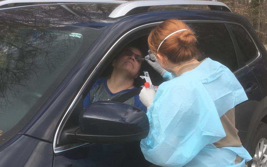 Jakawana Minton, a civilian at the U.S. Army garrison in Stuttgart, gets screened for the coronavirus at a drive-through site next to the health clinic on Patch Barracks. The number of cases within the military community in Stuttgart stood at 15 as of Wednesday, March 18, 2020.