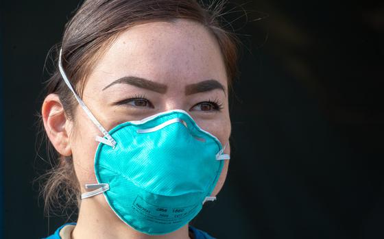 Senior Airman Michelle Westerman, a medical technician, wears an N-95 respirator as a precaution while screening patients for the coronavirus at Ramstein Air Base, Germany, March 20, 2020.

