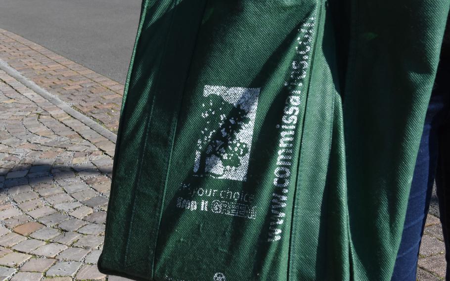 Reusable bags like this green eco-friendly fabric bag are no longer allowed in commissaries worldwide, one of several measures the Defense Commissary Agency has implemented to reduce the spread of the coronavirus. Baggers are also no longer bagging groceries for customers.