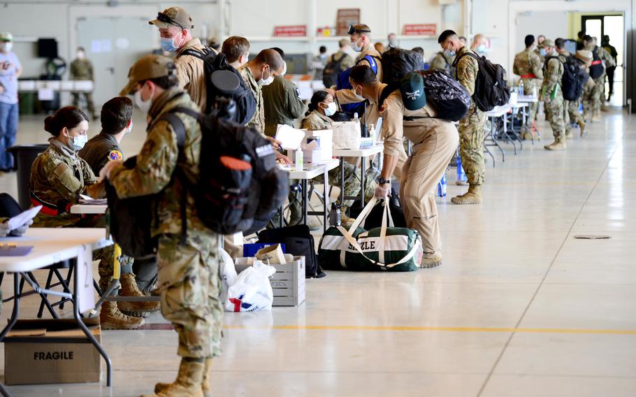 Airmen from across the 31st Fighter Wing, including the 555th Fighter Squadron, participate in coronavirus screenings as they return from deployment, at Aviano Air Base, Italy, April 18, 2020.