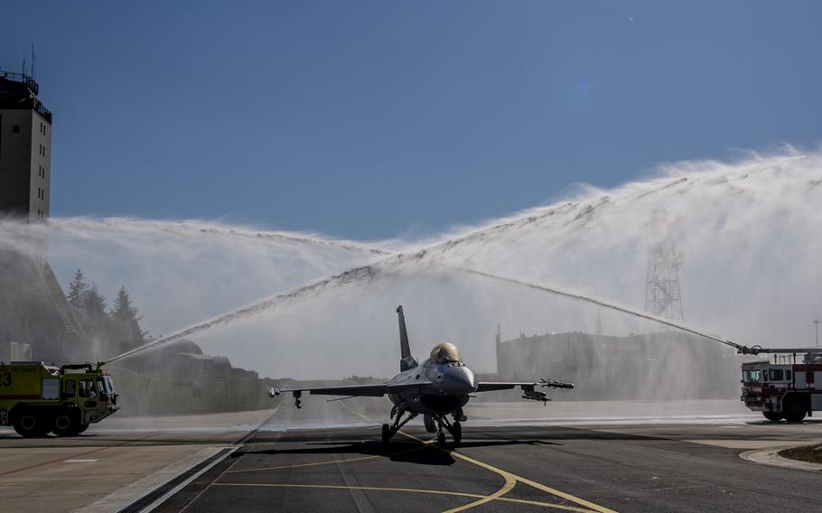 An F-16 Fighting Falcon assigned to the 52nd Fighter Wing at Spangdahlem Air Base, Germany, is given a water salute on Thursday, April 23, 2020, after completing 10,000 flight hours. The F-16 was the first in Europe, and only the second in the U.S. Air Force's inventory, to cross the 10,000 flight-hour mark.