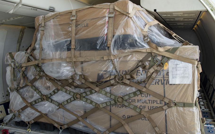 Mail bound for Europe is secured aboard a C-40A aircraft at Camp Lemonnier, Djibouti, April 22, 2020.