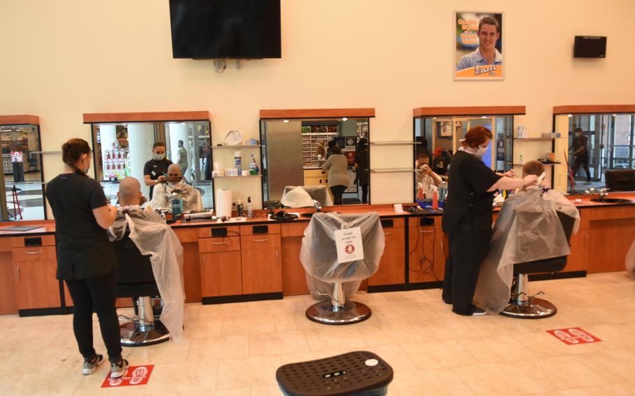To maintain social distancing requirements, customers sat in every other barber chair at the Kaiserslauterm Military Community Center barbershop on Monday, May 4, 2020, at Ramstein Air Base, Germany.