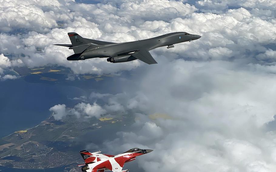 A B-1B Lancer flies with a Danish F-16 during a training mission for Bomber Task Force Europe, May 5, 2020.