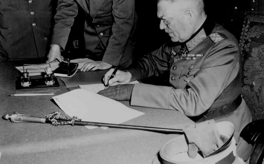 Field Marshal Wilhelm Keitel signing the German surrender in Berlin, on May 9, 1945. The event took place two days after a document was signed by German officials in Reims, France, and announced the following day, May 8.