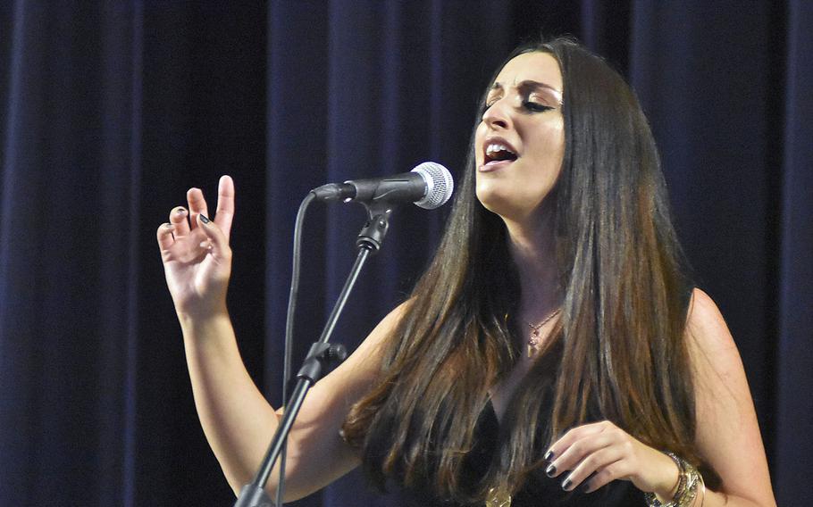 Heather Ann Simpson, one of four military spouses entered in Aviano Idol, performs a song Monday, May 11, 2020, in the base theater at Aviano Air Base, Italy.