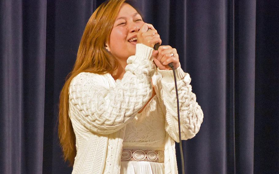 Sandra Aquino-Javier performs Monday, May 11, 2020, during the first night of the Aviano Idol competition at the base theater. She sang a version of ''Over the Rainbow'' popular in her native Philippines.