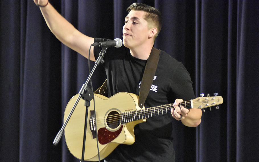 Senior Airman Logan Schmidt gestures while performing a song Monday, May 11, 2020, in the first round of the Aviano Idol competition. Schmidt, with the 31st Medical Group, was the only performer to play an instrument.