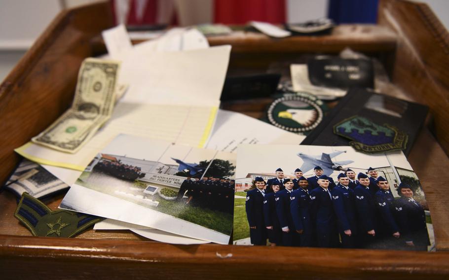 Various items are displayed on top of a time capsule at Aviano Air Base, Italy, May 15, 2020. The 31st Logistics Readiness Squadron found the time capsule, prepared by a 1999 class from the Aviano Airman Leadership School.