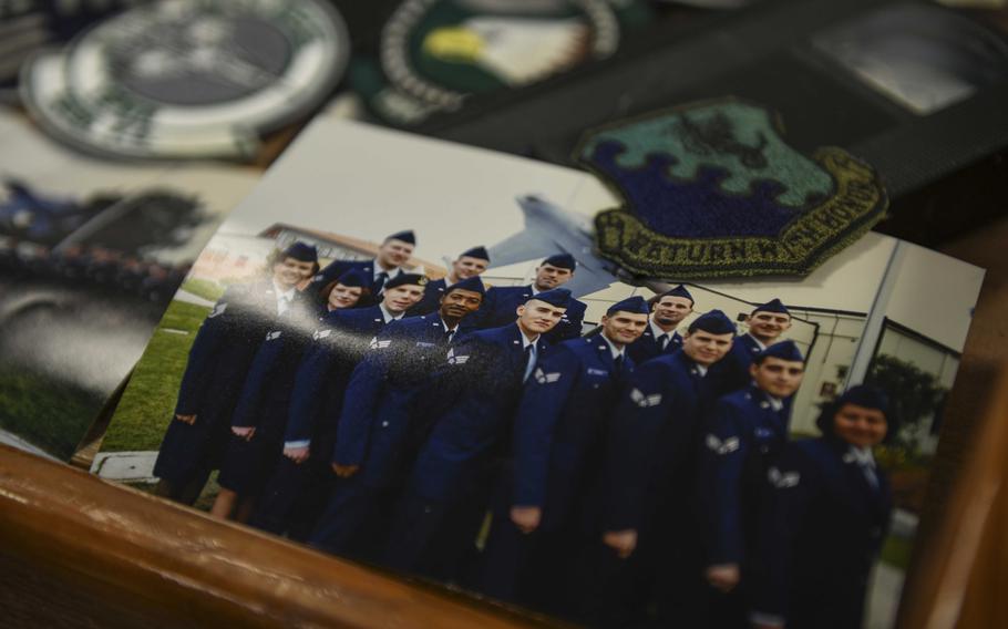 A picture of the Aviano Airman Leadership School's class 99-A, from a time capsule prepared in 1999, is displayed with a wyvern patch and videotape at Aviano Air Base, Italy, May 15, 2020. The class was made up of two flights with a total of 23 students.