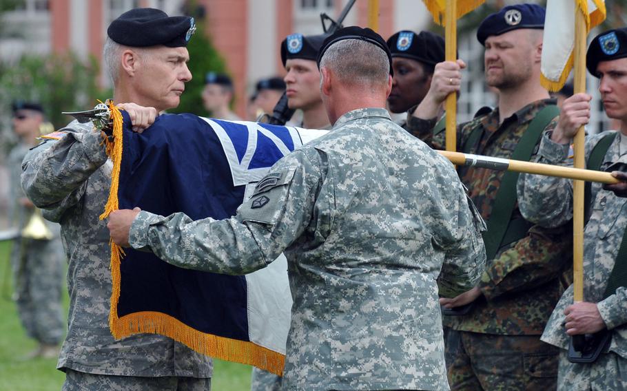 Corps commander Gen. James Terry, left, and Command Sgt. Maj. William Johnson case the V Corps colors at the unit's inactivation ceremony in Wiesbaden, Germany, June 12, 2013. The Army is reactivating V Corps, it announced May 19, 2020. It will be located at Fort Knox, Ky.