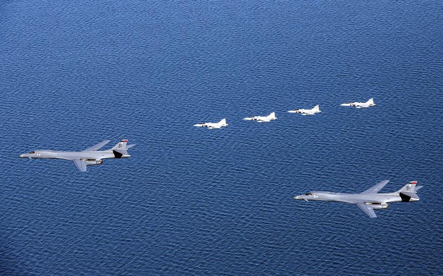 A pair of U.S.-based B-1B bombers fly beside four Swedish Armed Forces Gripen fighter jets for the first time over Sweden during training May 19, 2020.