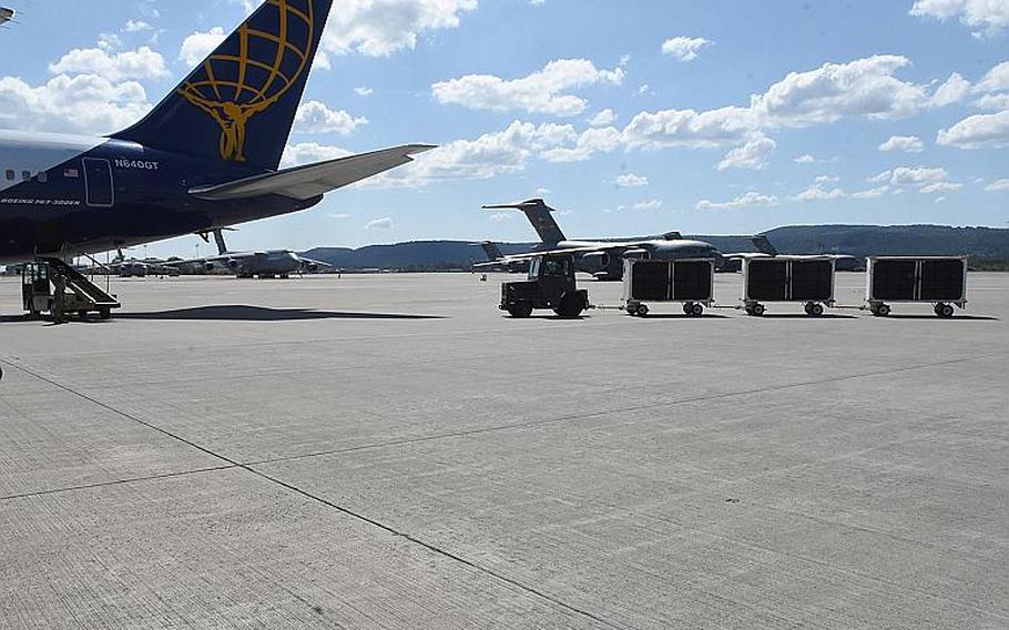 Animals belonging to military personnel are driven out to an airliner contracted to transport servicemembers, their families and pets, on Friday, May 29, 2020, at Ramstein Air Base, Germany.