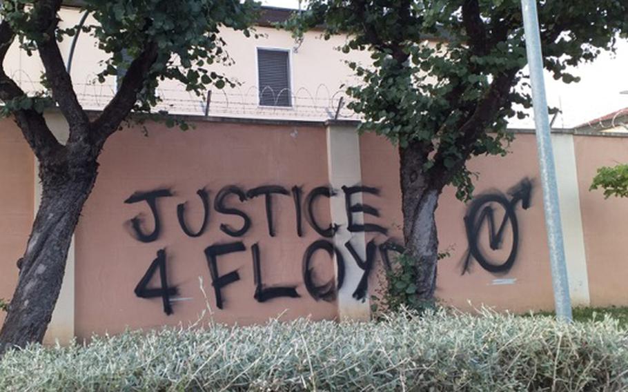 "Justice 4 Floyd!" is one of the slogans spray-painted on the perimeter wall at Caserma Ederle, which hosts U.S. Army Garrison Italy and U.S. Army Africa, on Monday, June 2, 2020. The graffiti, which was part of a brief gathering protesting the killing of George Floyd, had been removed by Tuesday.