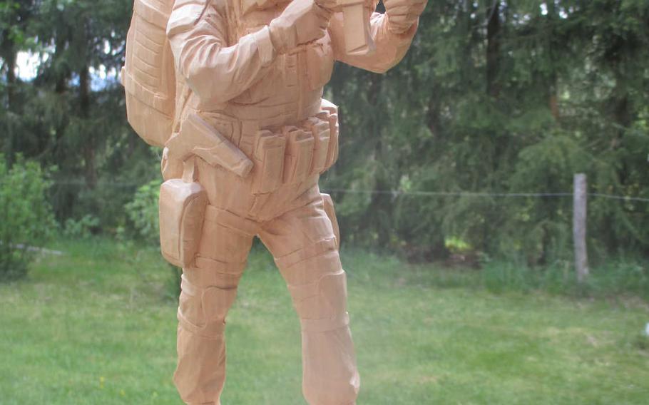 A U.S. Army Special Forces soldier carved by Sebastian Demmel. The thousands of wood carvings that Demmel has made over the past 50 years for American soldiers in Germany have earned him a nomination to be the first honorary Green Beret from Germany.