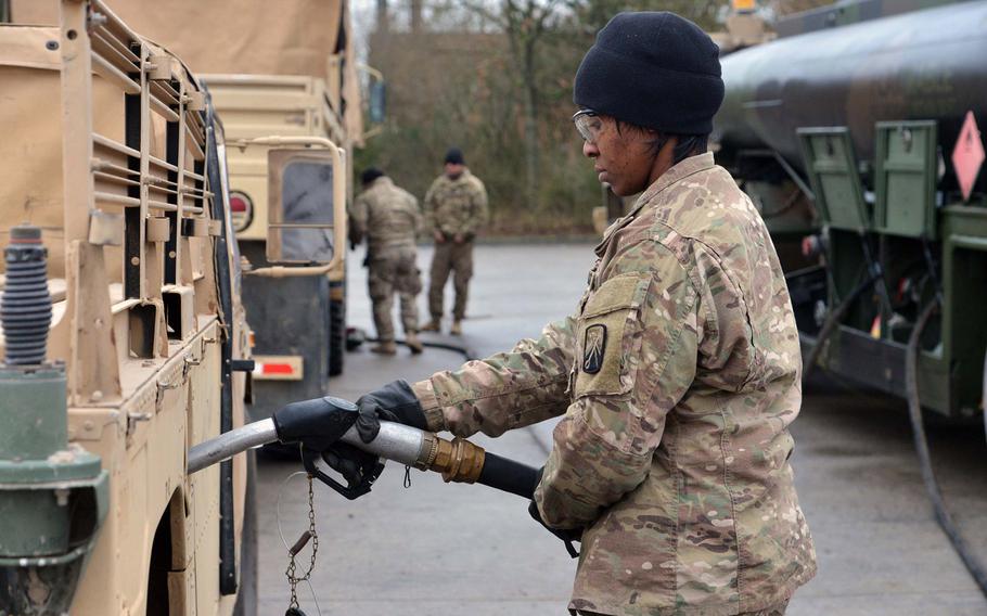 Staff Sgt. Priscella Gray of the Baumholder, Germany-based 515th Transportation Company, part of the 16th Sustainment Brigade, fuels up a Humvee convoying from Bremerhaven to Poland in 2017. Army support units in Germany could leave under a White House plan to remove 9,500 troops from Germany, The New York Times reported Friday.
