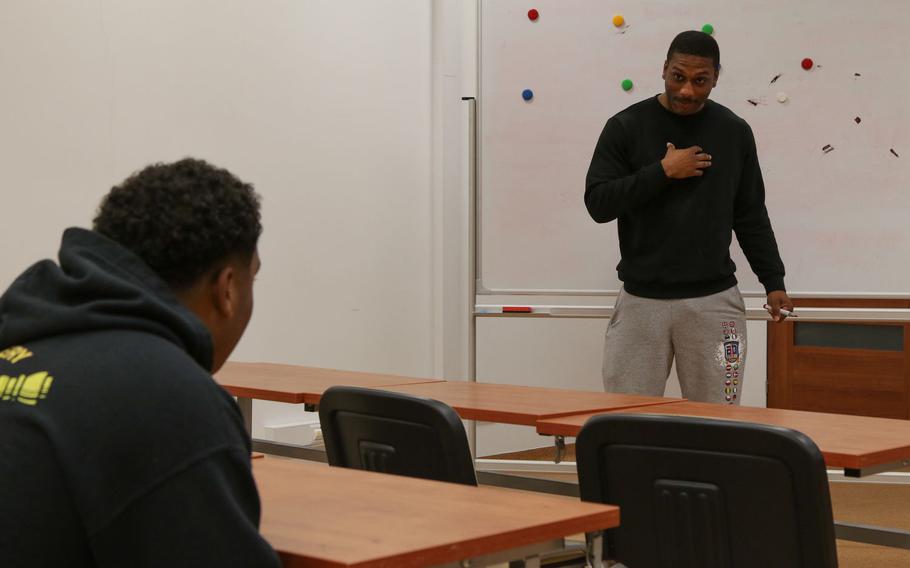 U.S. Army 1st Lt. Kyle Jackson, assigned to 444th Human Resources Company, pantomimes for a vocabulary game during a Polish language class for troops at Bemowo Piskie Training Area, Poland, June 9, 2020.